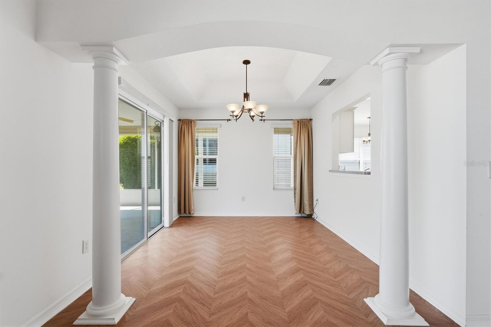 Dining room with the flooring continuing seamlessly. - 1563 EASTOVER TER, THE VILLAGES