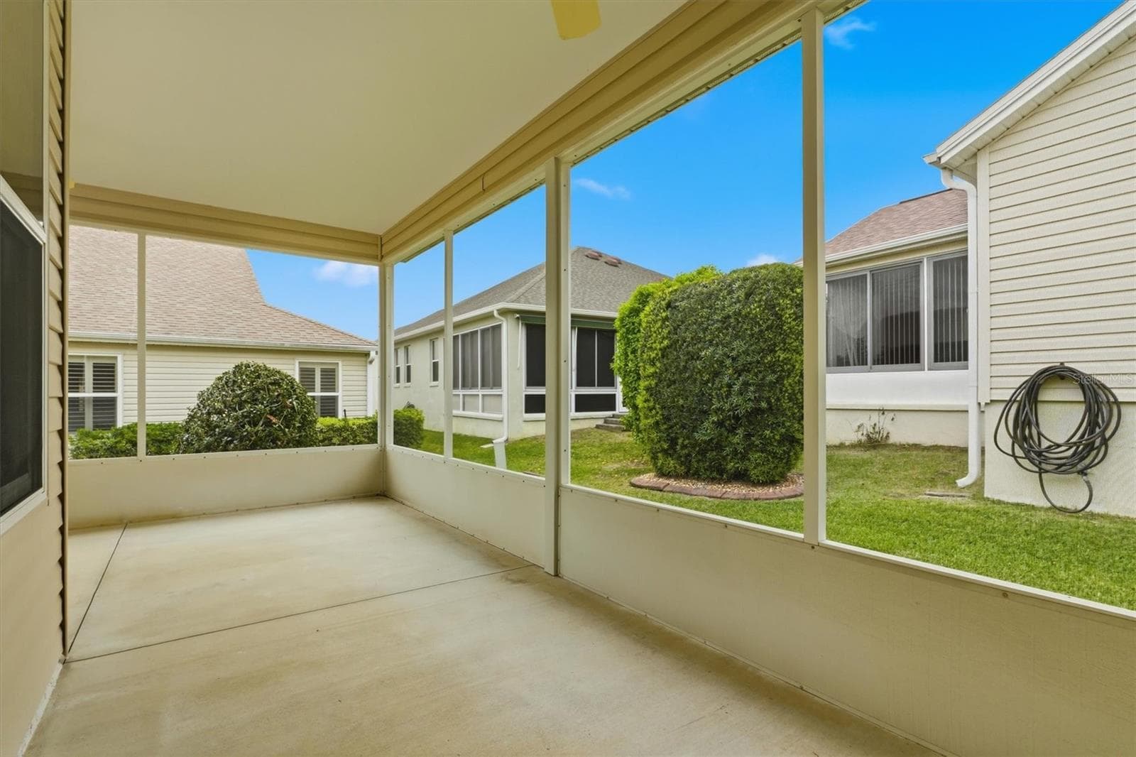 Screened Lanai wraps around the back of the house. - 1563 EASTOVER TER, THE VILLAGES