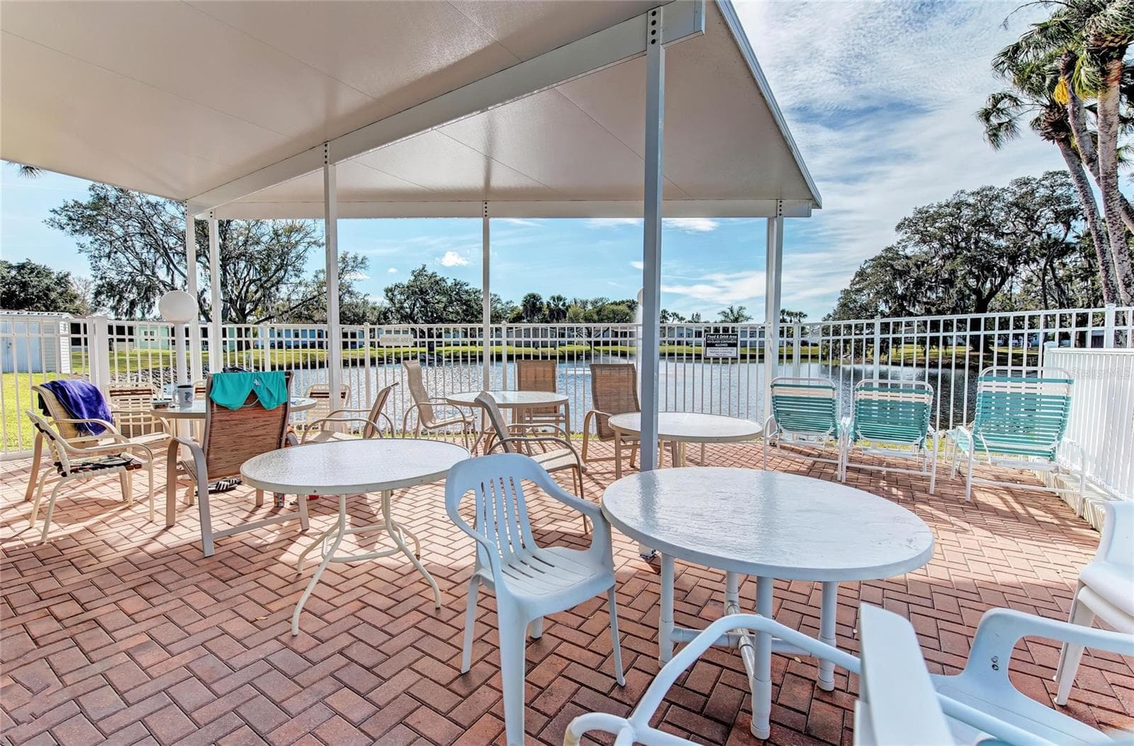 Covered gathering area at pool and clubhouse - 42 MEADOWLARK CIR, ELLENTON