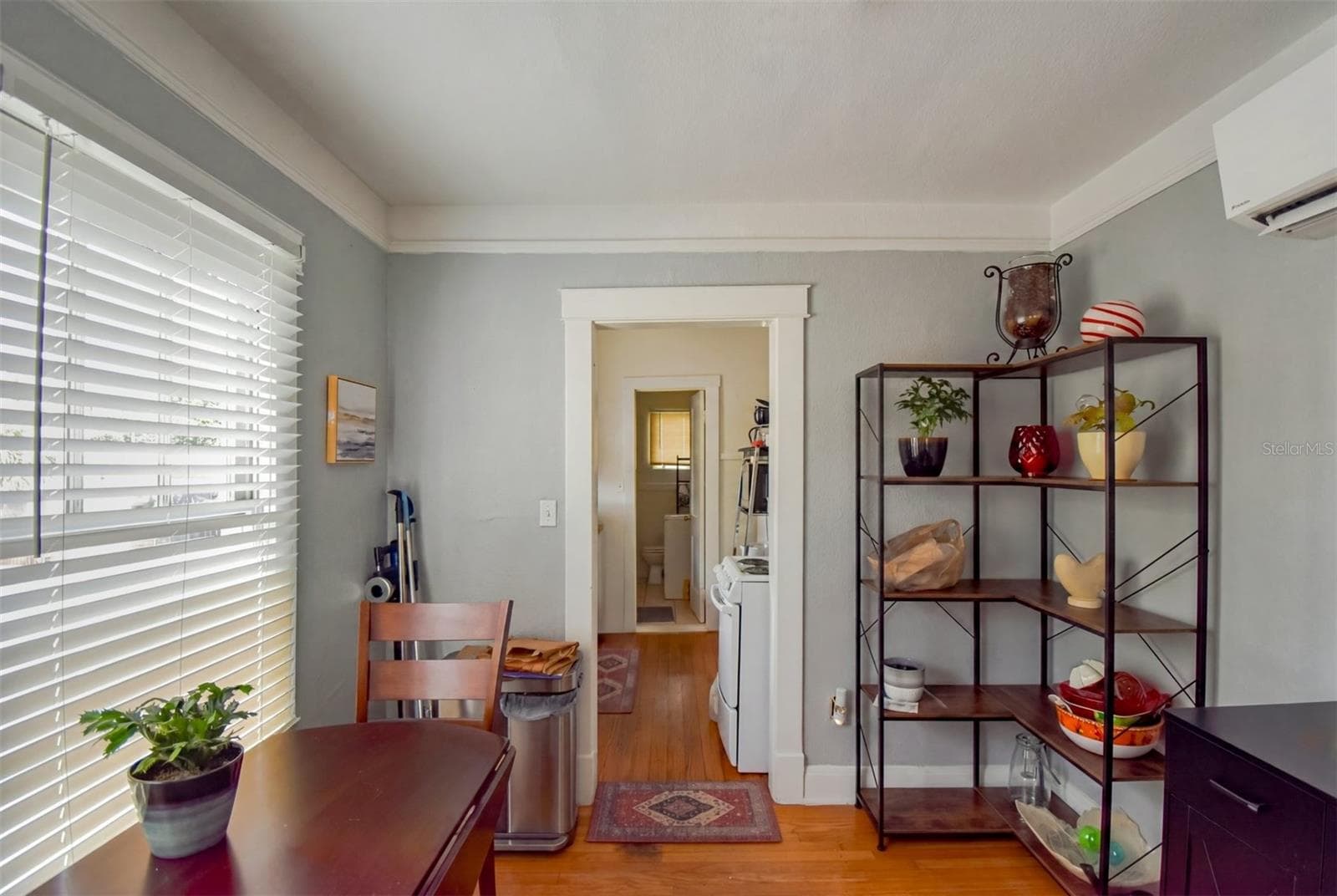 Dining area and kitchen, hardwood floors - 940 BRADSHAW TER, ORLANDO