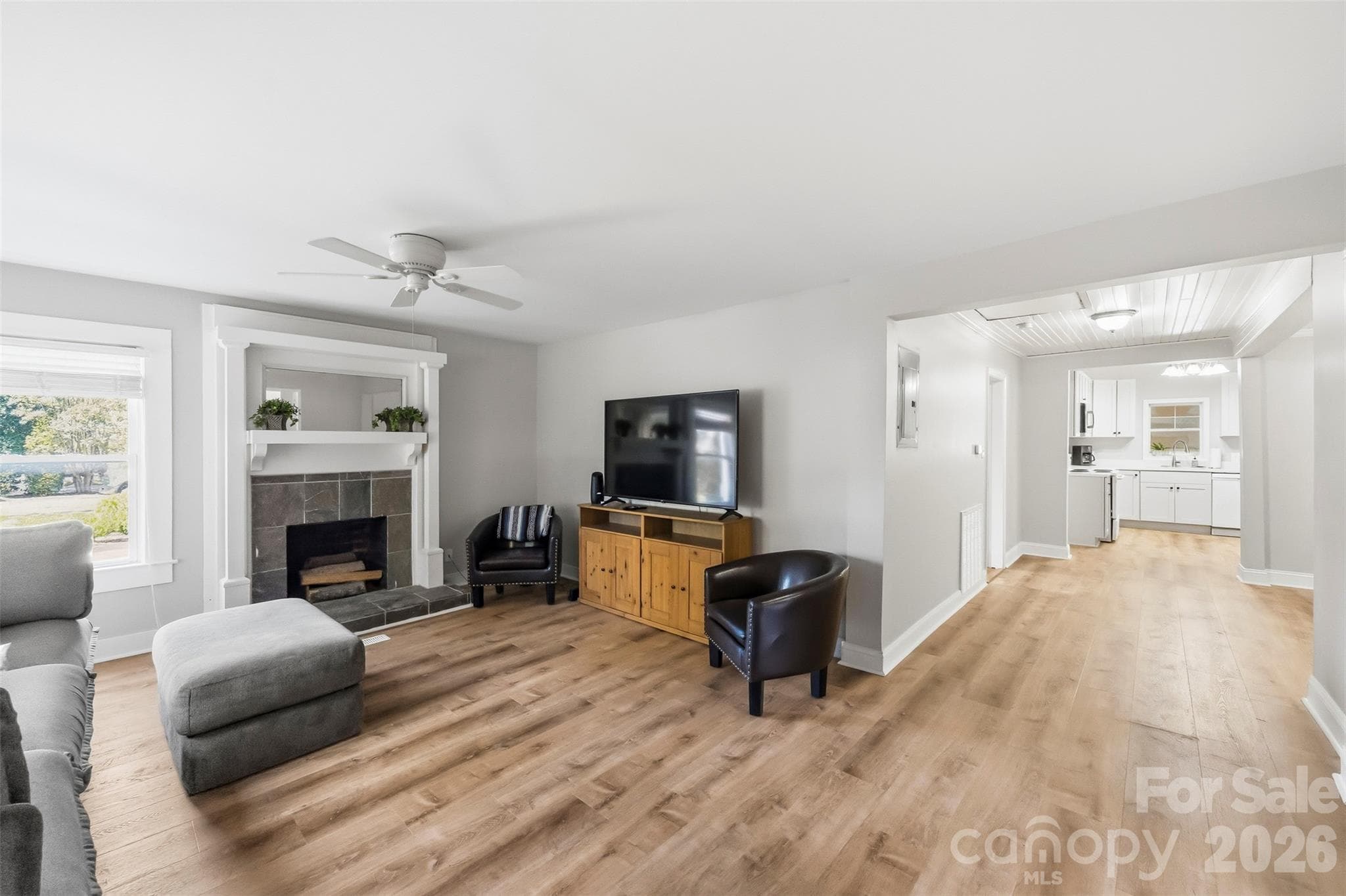 Living room (16'11" x 13'3") with a fireplace. - 220 Armour Street, Davidson