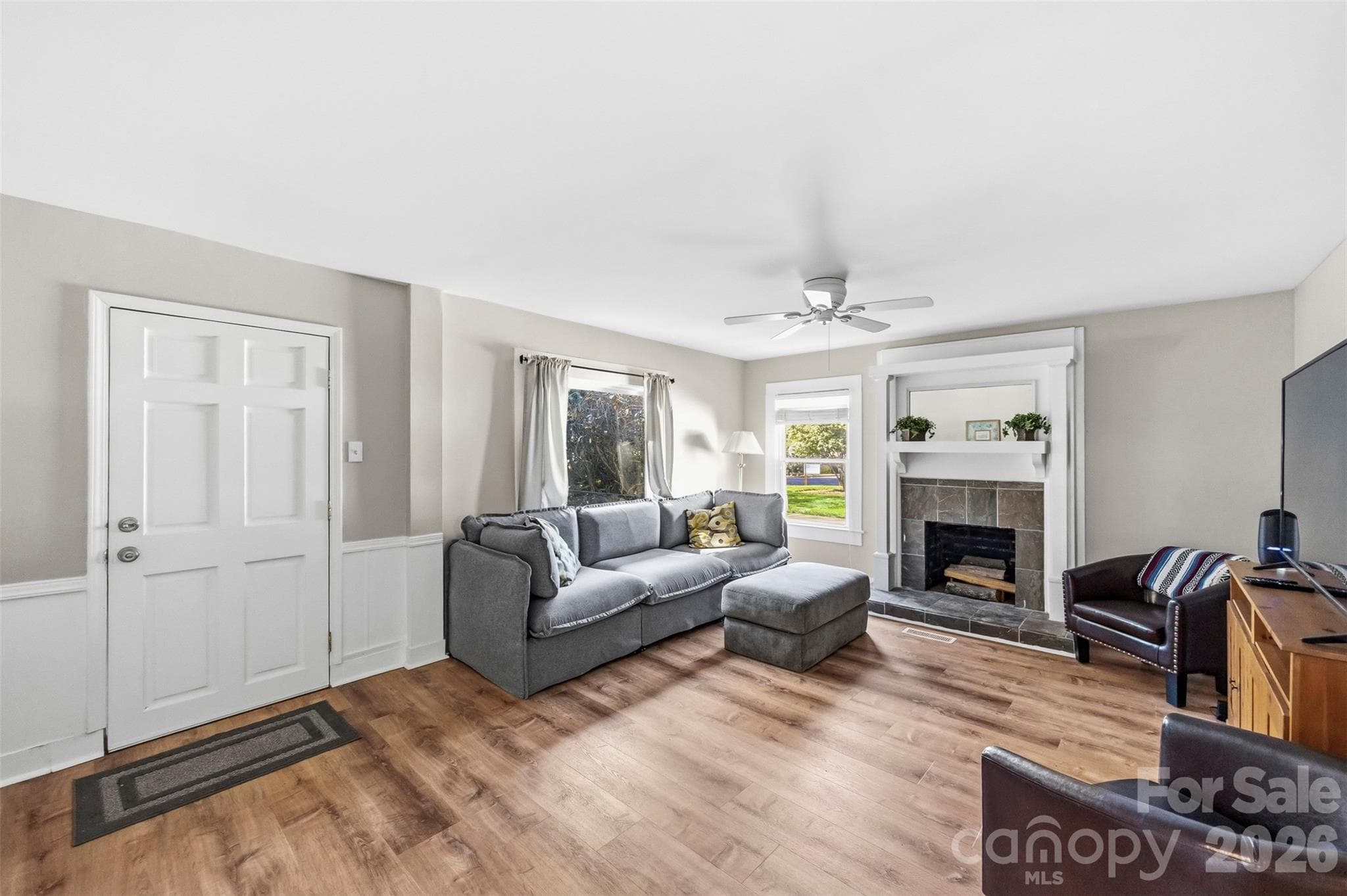 Living room from the front entry, with wainscoting. - 220 Armour Street, Davidson