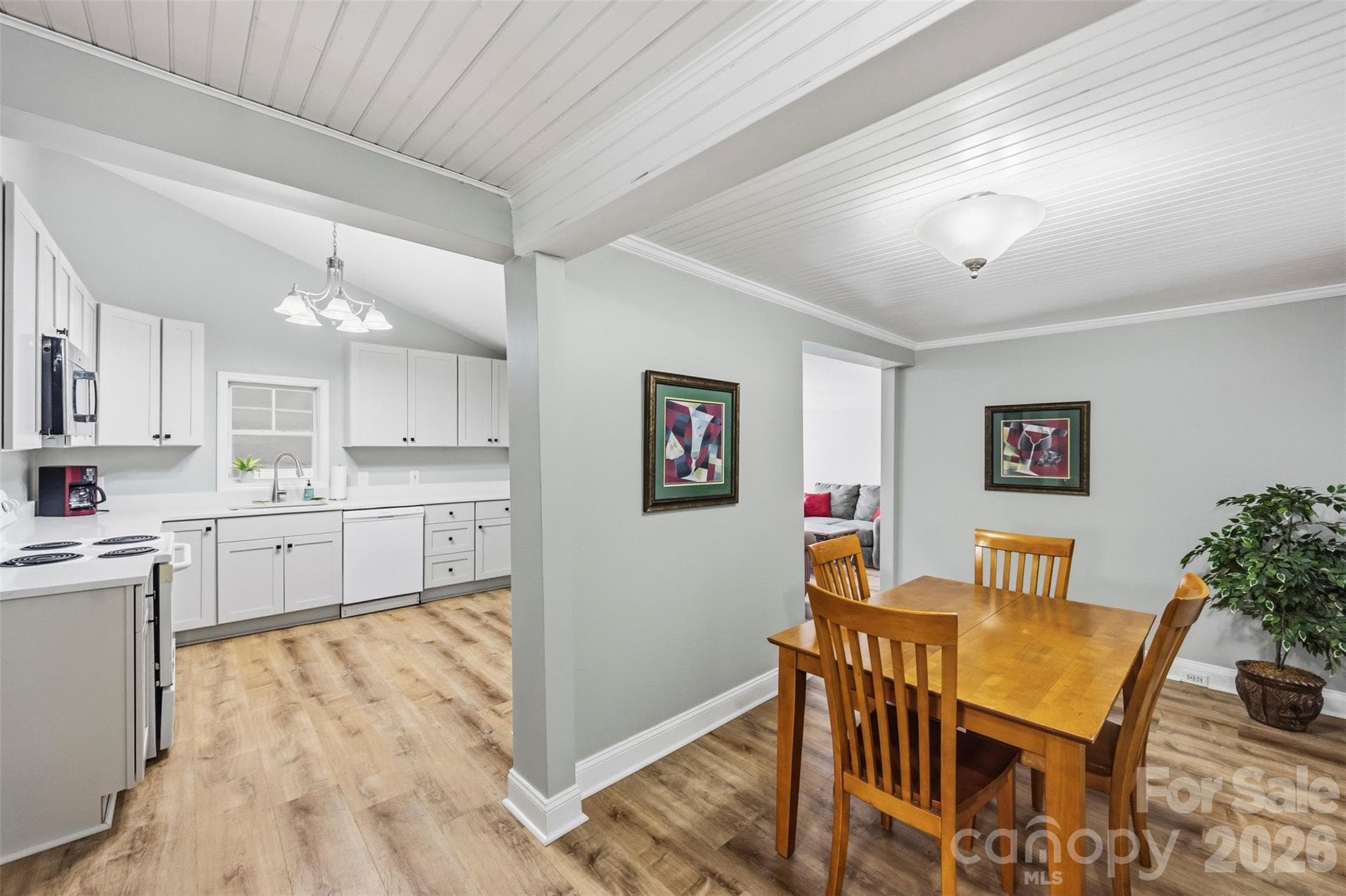Dining area (17'2" x 13'9") open to the kitchen, with a beadboard ceiling. - 220 Armour Street, Davidson