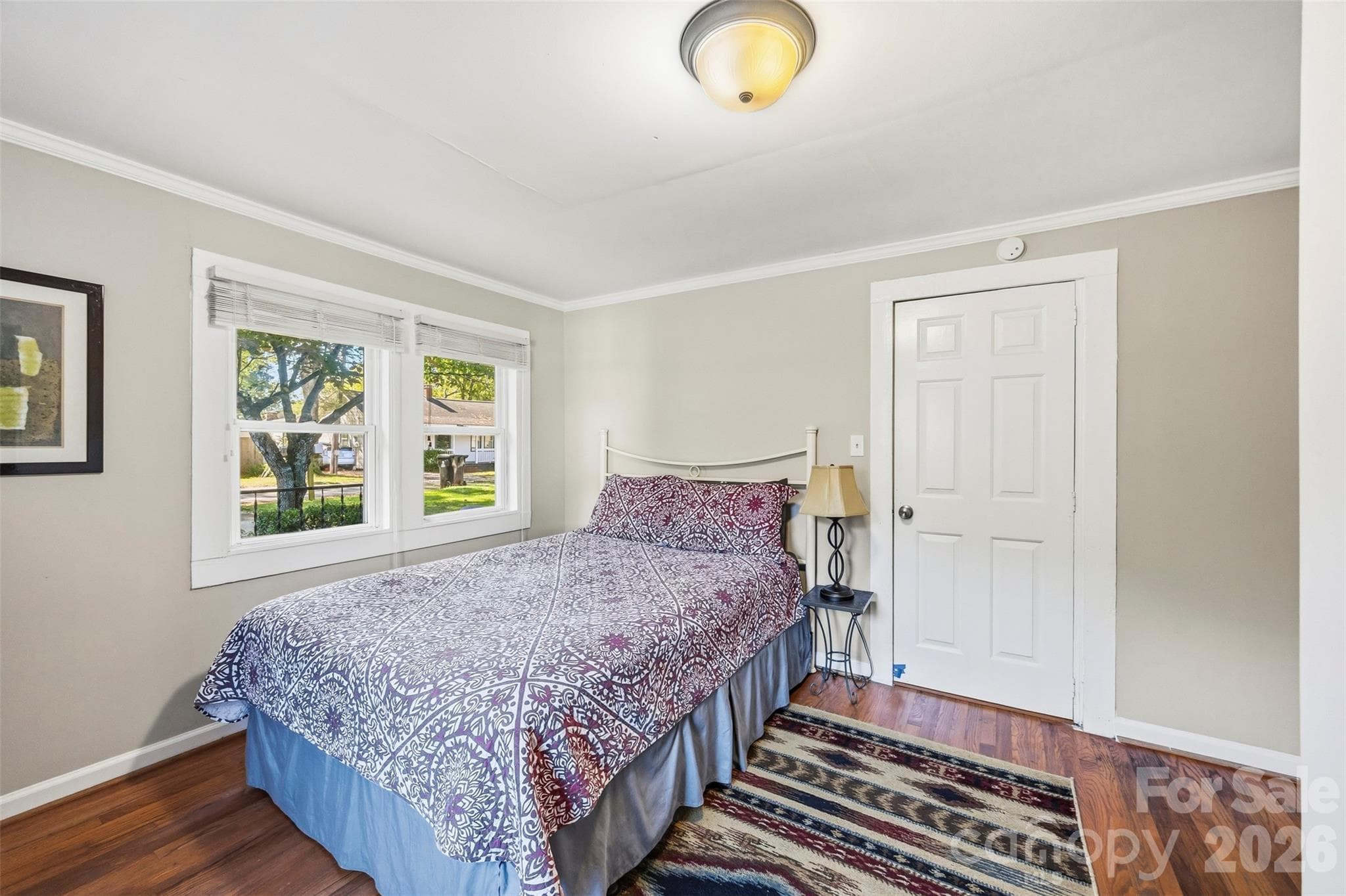 Front bedroom (11'5" x 13'11") with hardwood floors. - 220 Armour Street, Davidson
