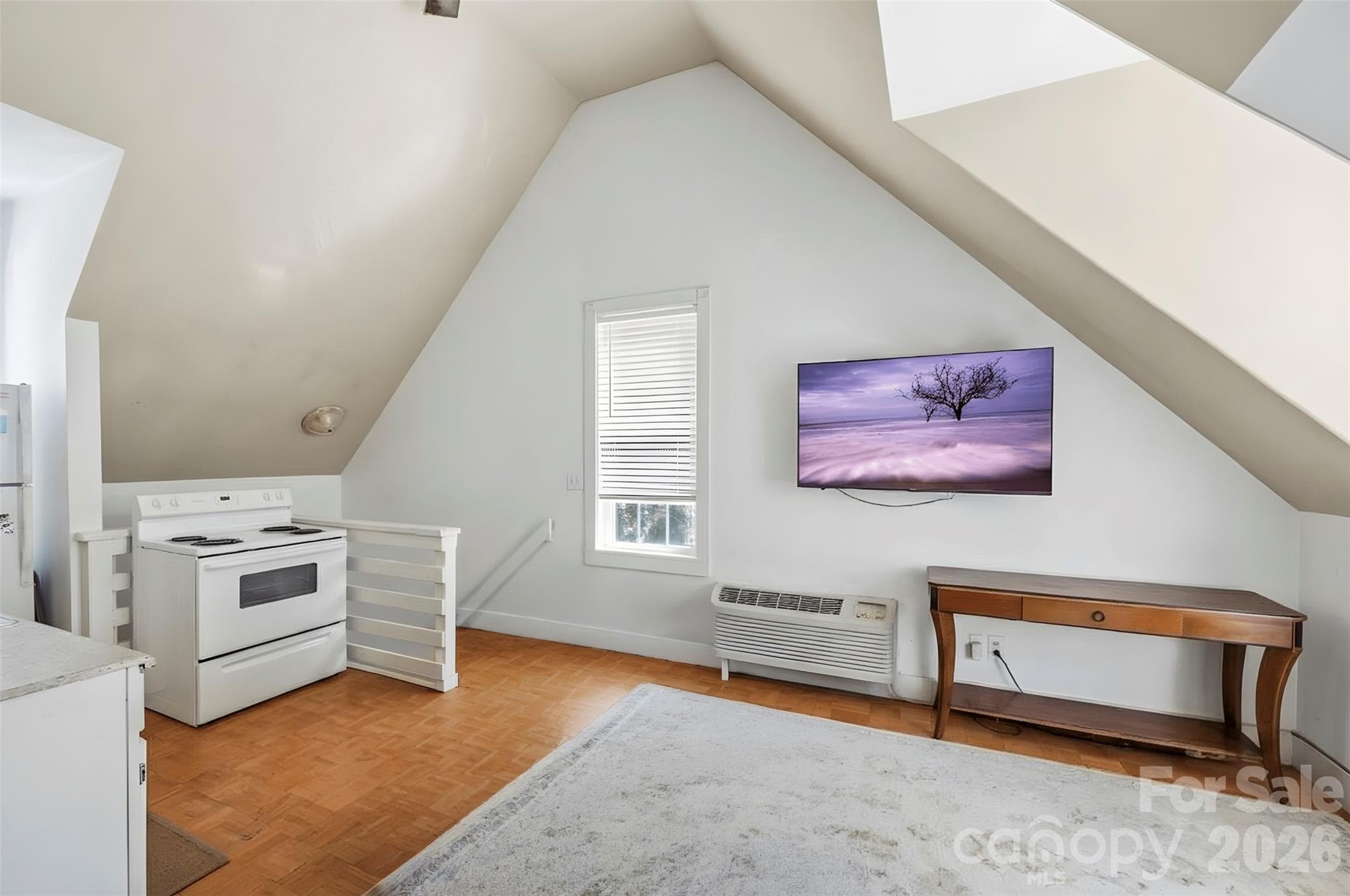 Unit C living room (9'6" x 13'3"), open to the kitchen. - 220 Armour Street, Davidson