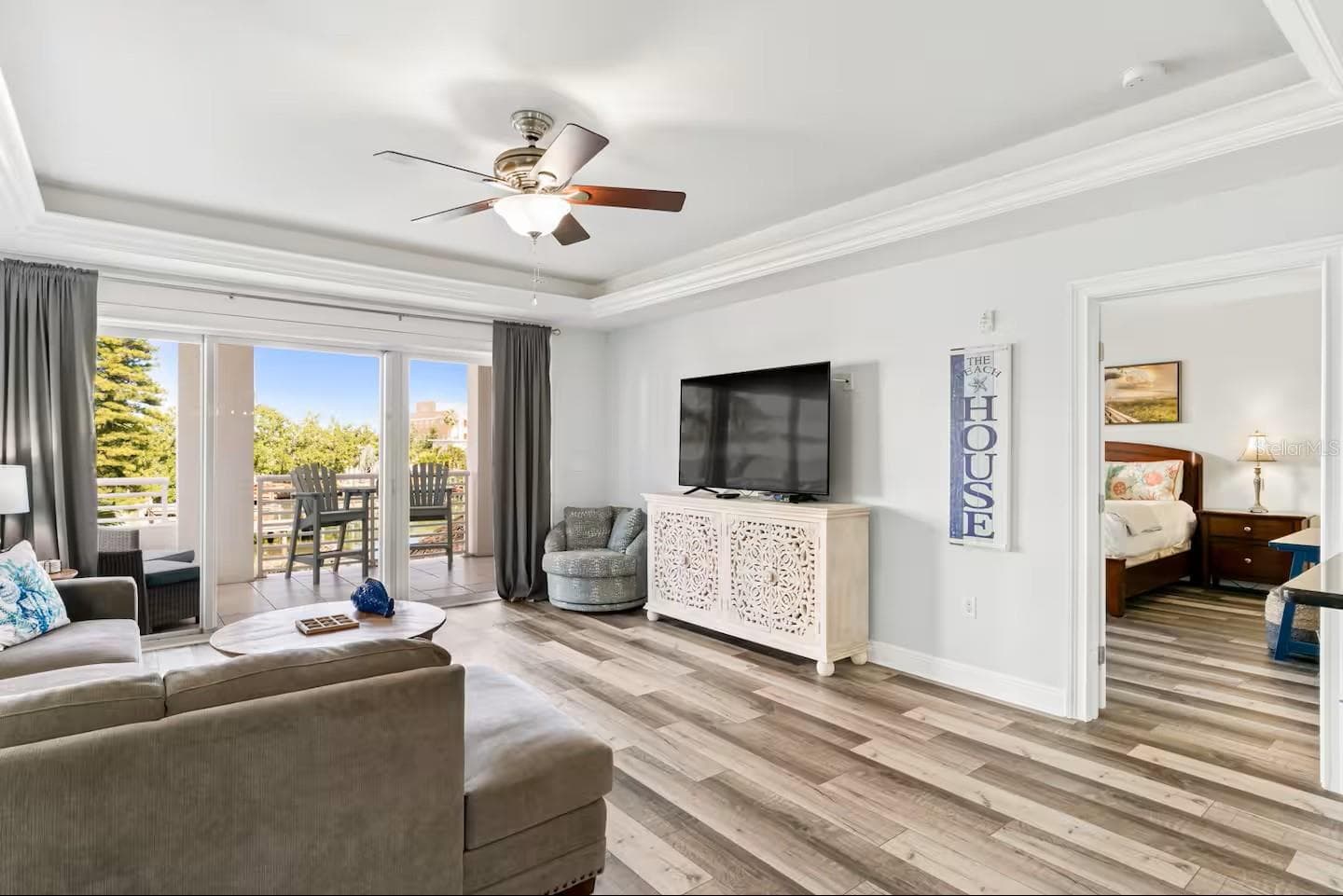 Spacious living room with access to the balcony - 100 BAYSIDE DR #101, CLEARWATER