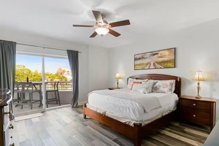 Primary Bedroom with patio access - 100 BAYSIDE DR #101, CLEARWATER