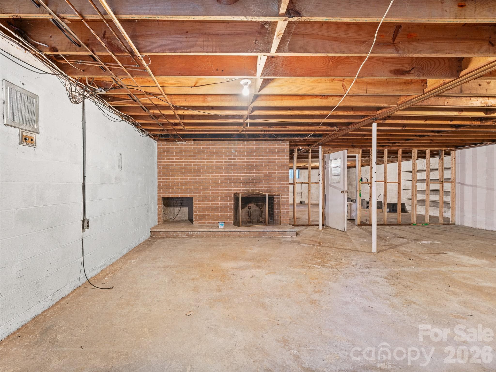 Basement with Wood-Burnsville Fireplace - 198 Roland Hill Road, Burnsville