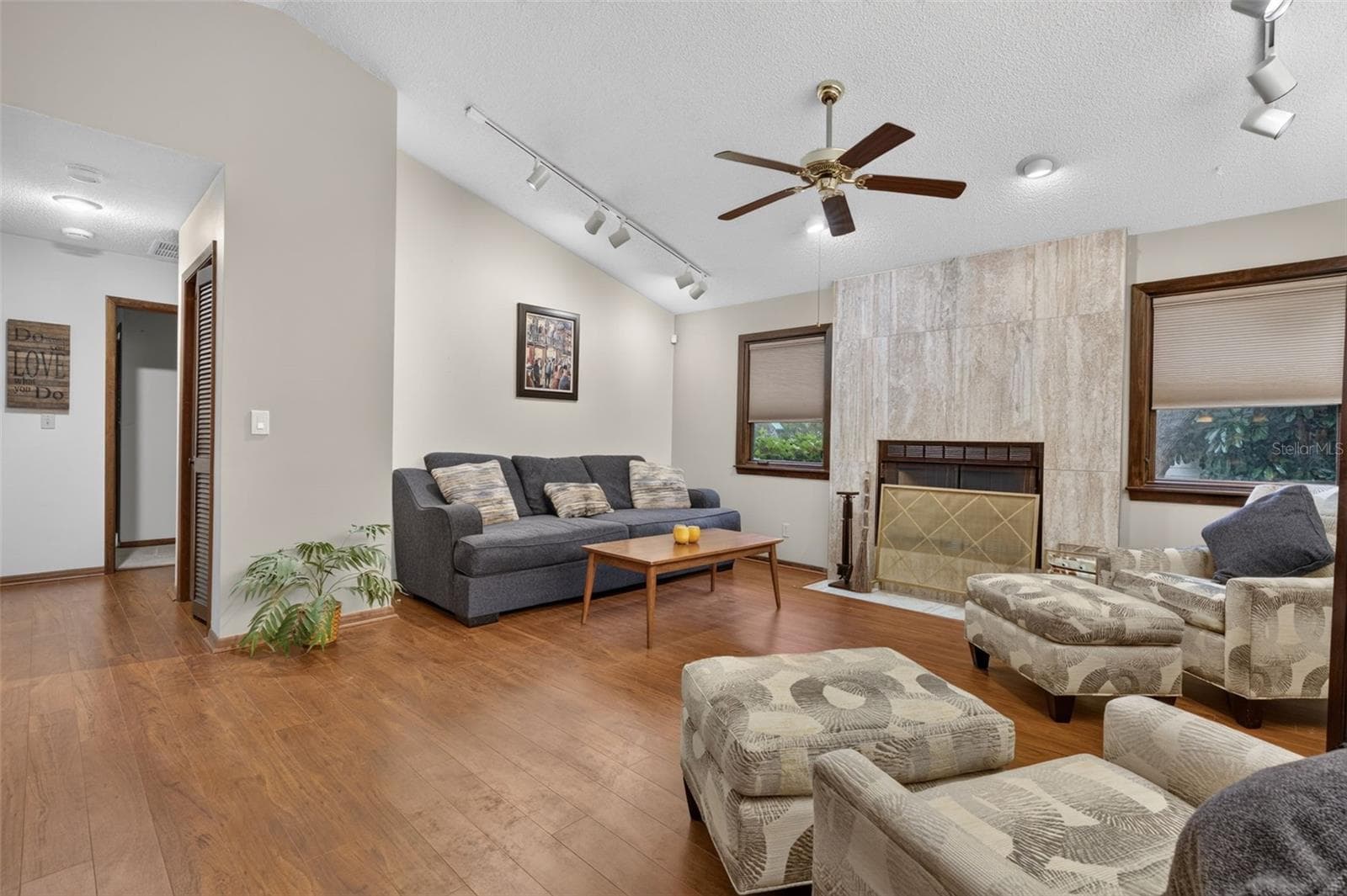 Living Room w/wood burning fireplace - 3300 MEADOW VIEW LN, PALM HARBOR