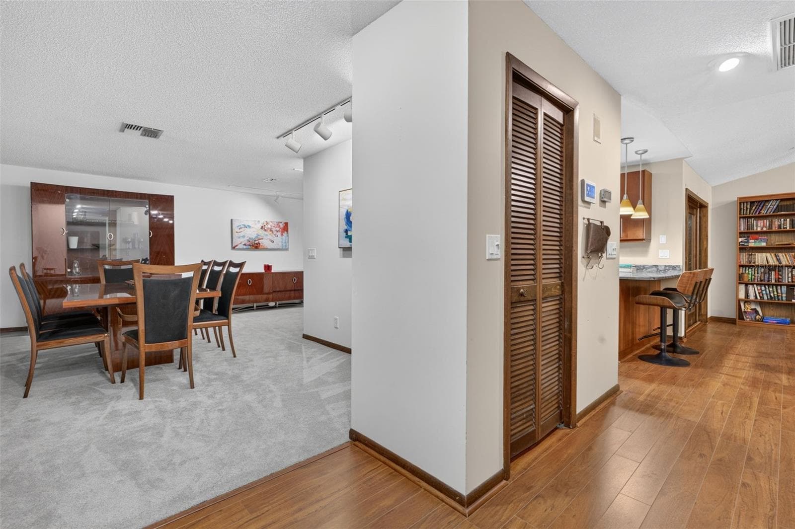 Foyer looking into dining room and coat closet - 3300 MEADOW VIEW LN, PALM HARBOR
