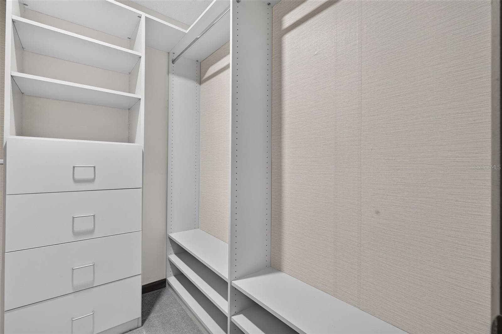 Primary bedroom walk in closet system - 3300 MEADOW VIEW LN, PALM HARBOR