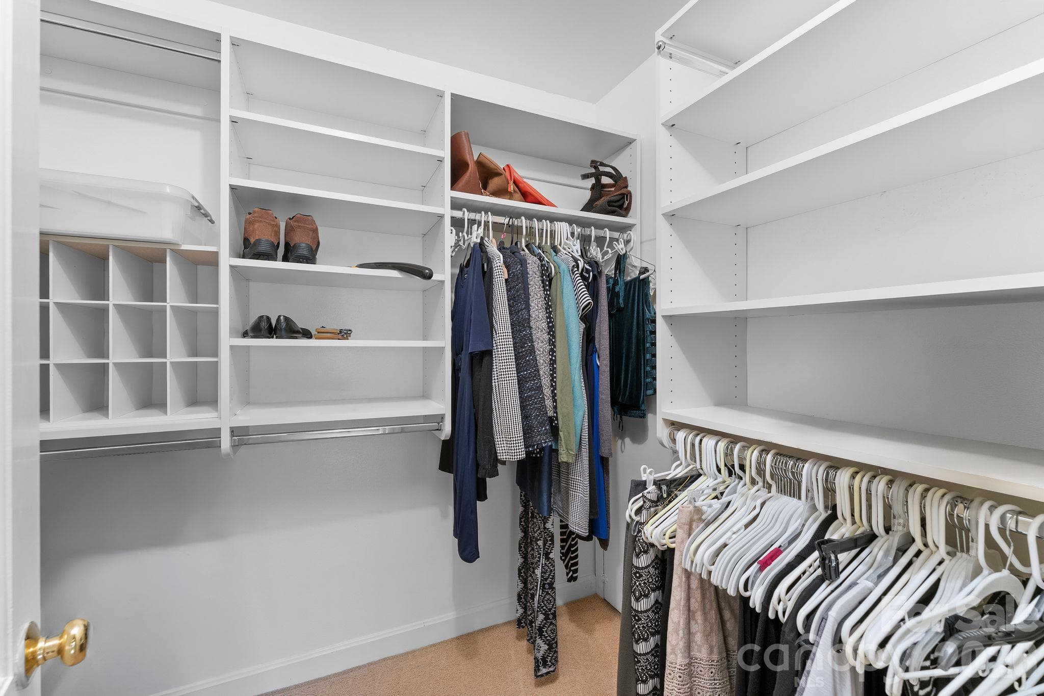Primary Closet with a closet system - 2006 Grey Road, Davidson
