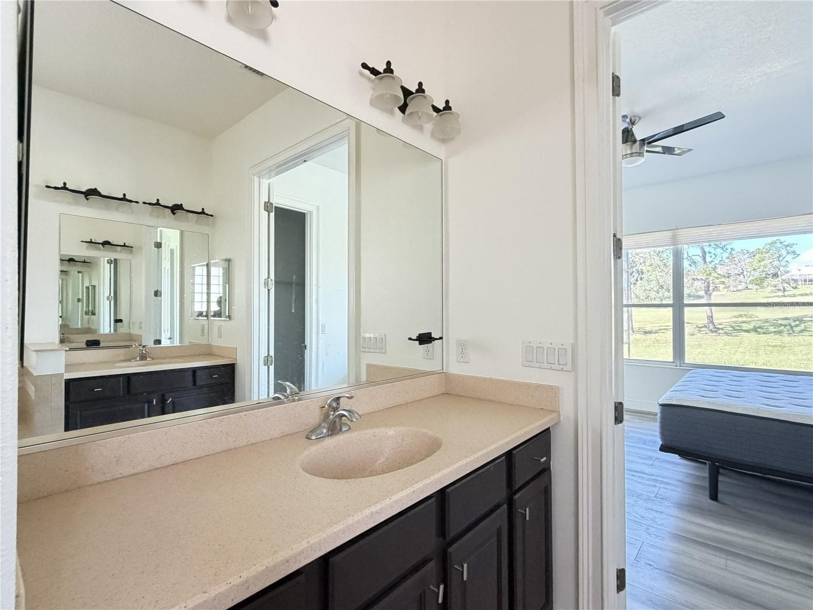 Primary ensuite with dual vanities. - 39539 HARBOR HILLS BLVD, LADY LAKE