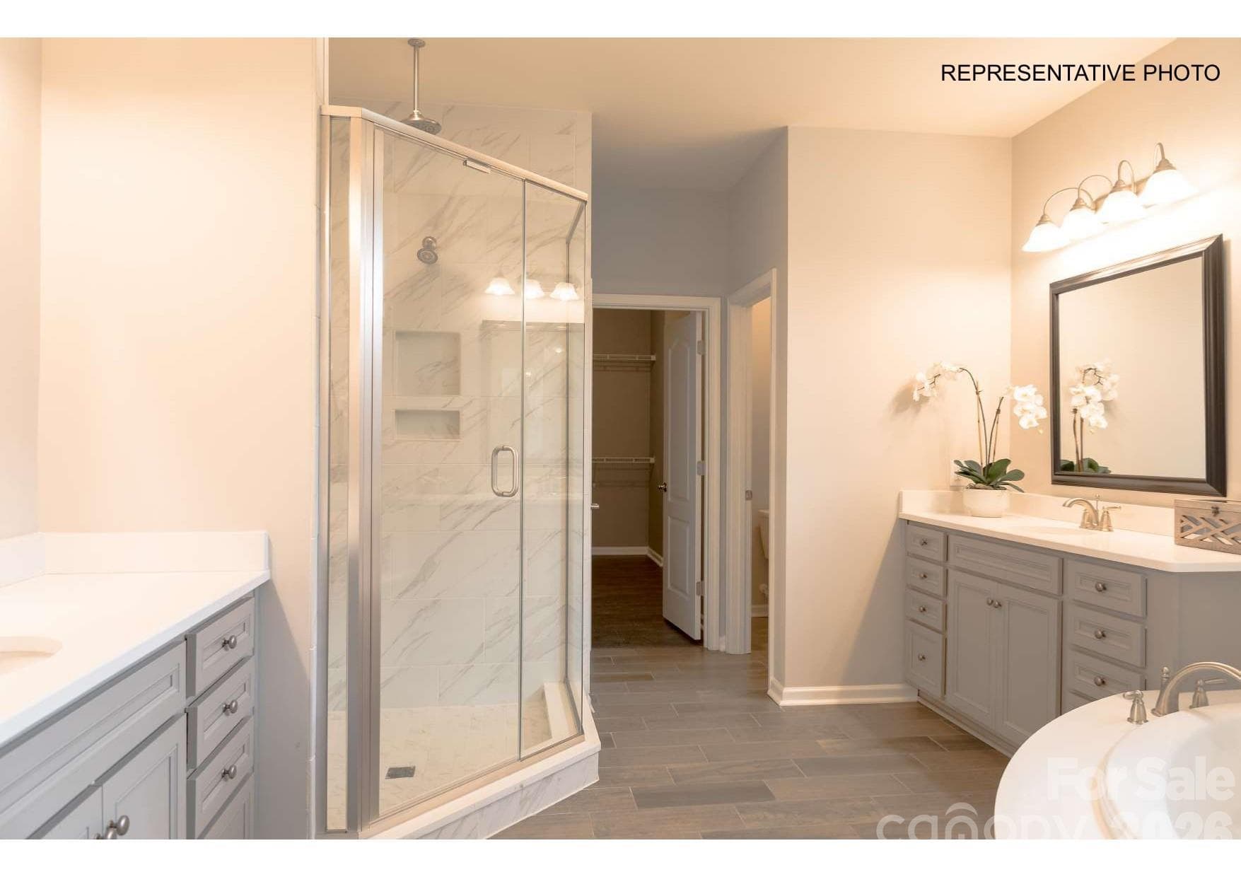 Incredibly-appointed owner's suite bathroom and HUGE walk-in closet! - 7689 Pedigree Circle, Lancaster