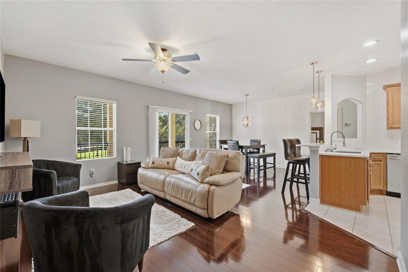 Open concept family dining area combo with Kitchen featuring laminate floors, ceiling fan - 15613 BOGGY OAK CIR #110A, WINTER GARDEN
