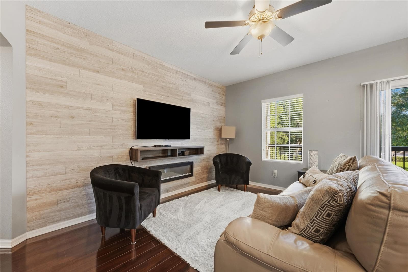 Beautiful accent wall featuring electric fireplace - 15613 BOGGY OAK CIR #110A, WINTER GARDEN