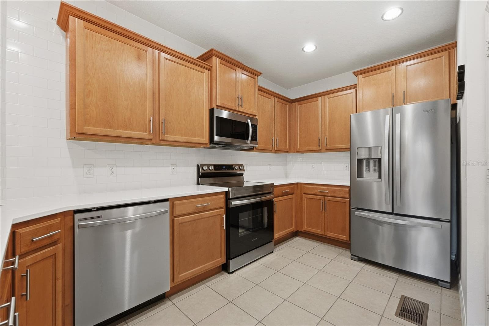 Kitchen with plenty of cabinet and counter space and appliances included - 15613 BOGGY OAK CIR #110A, WINTER GARDEN