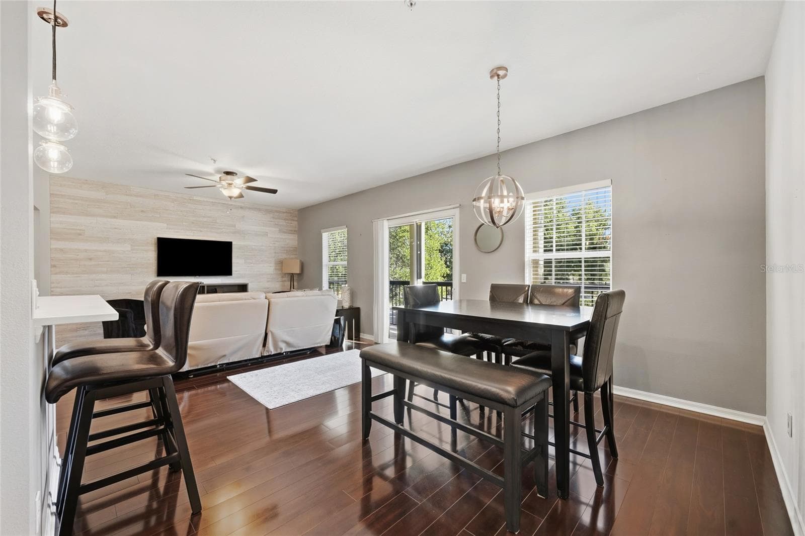 dining area/family room combo area with sliding glass door that leads to balcony - 15613 BOGGY OAK CIR #110A, WINTER GARDEN