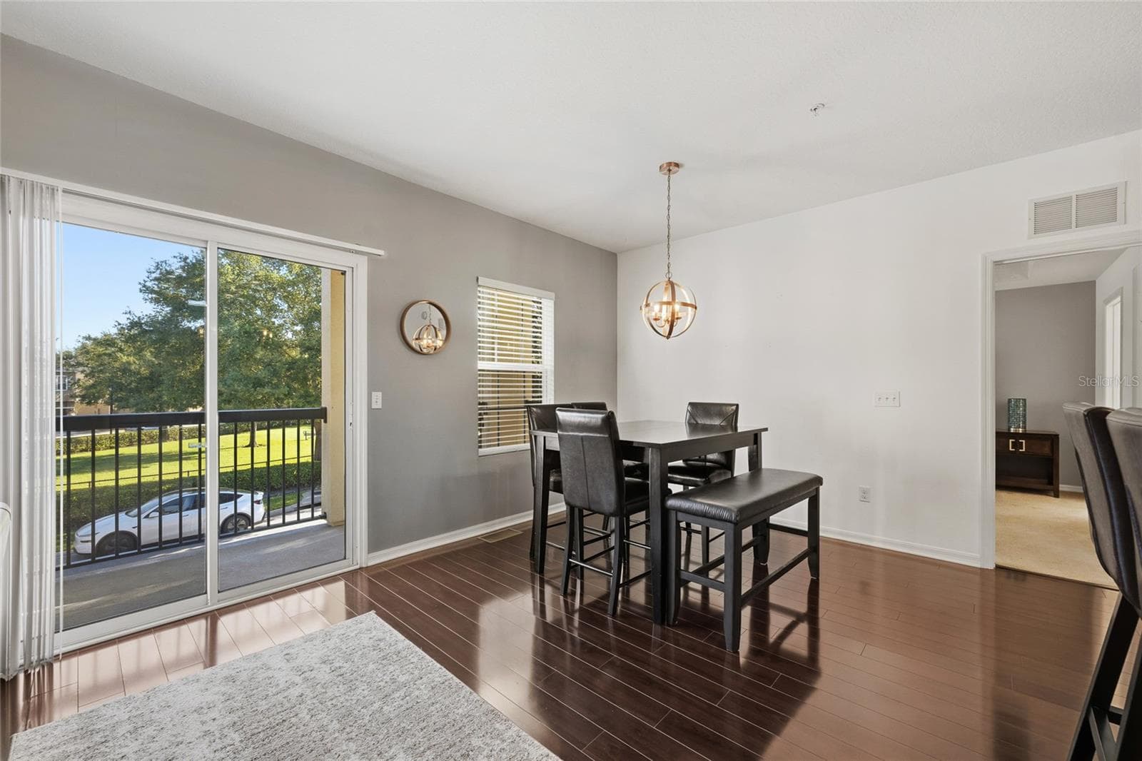 sliding glass door that leads to upper balcony perfect for afternoon relaxation - 15613 BOGGY OAK CIR #110A, WINTER GARDEN