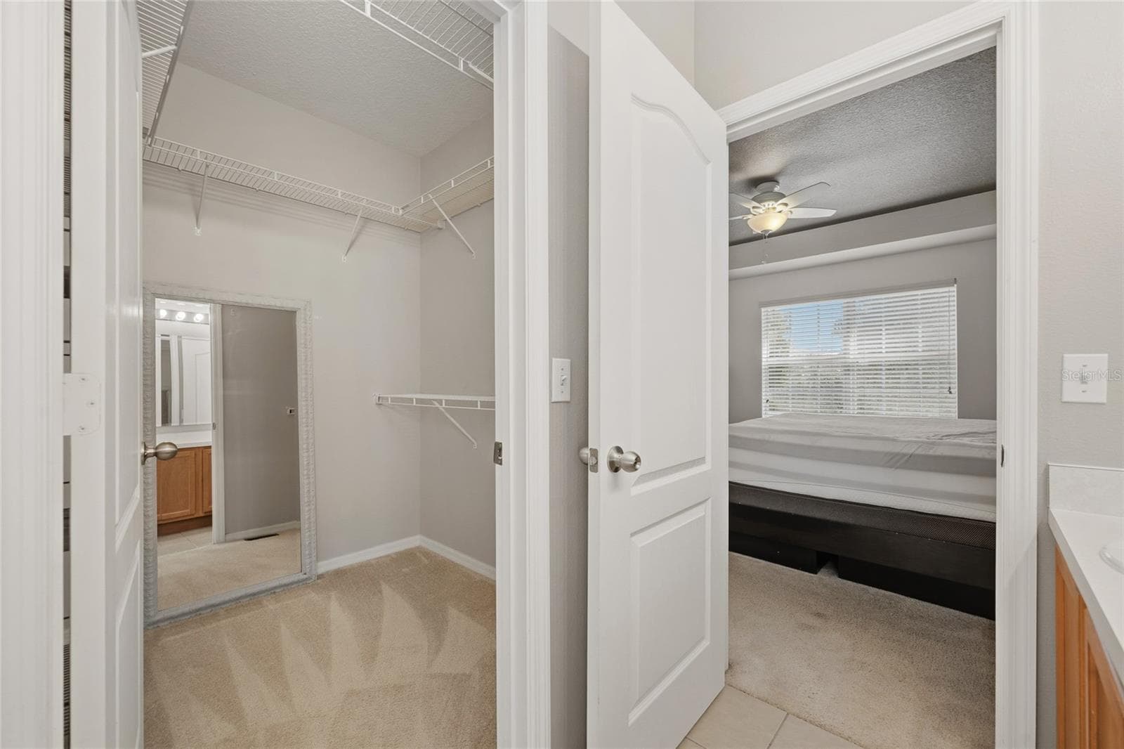 Primary bedroom walk in closet - 15613 BOGGY OAK CIR #110A, WINTER GARDEN