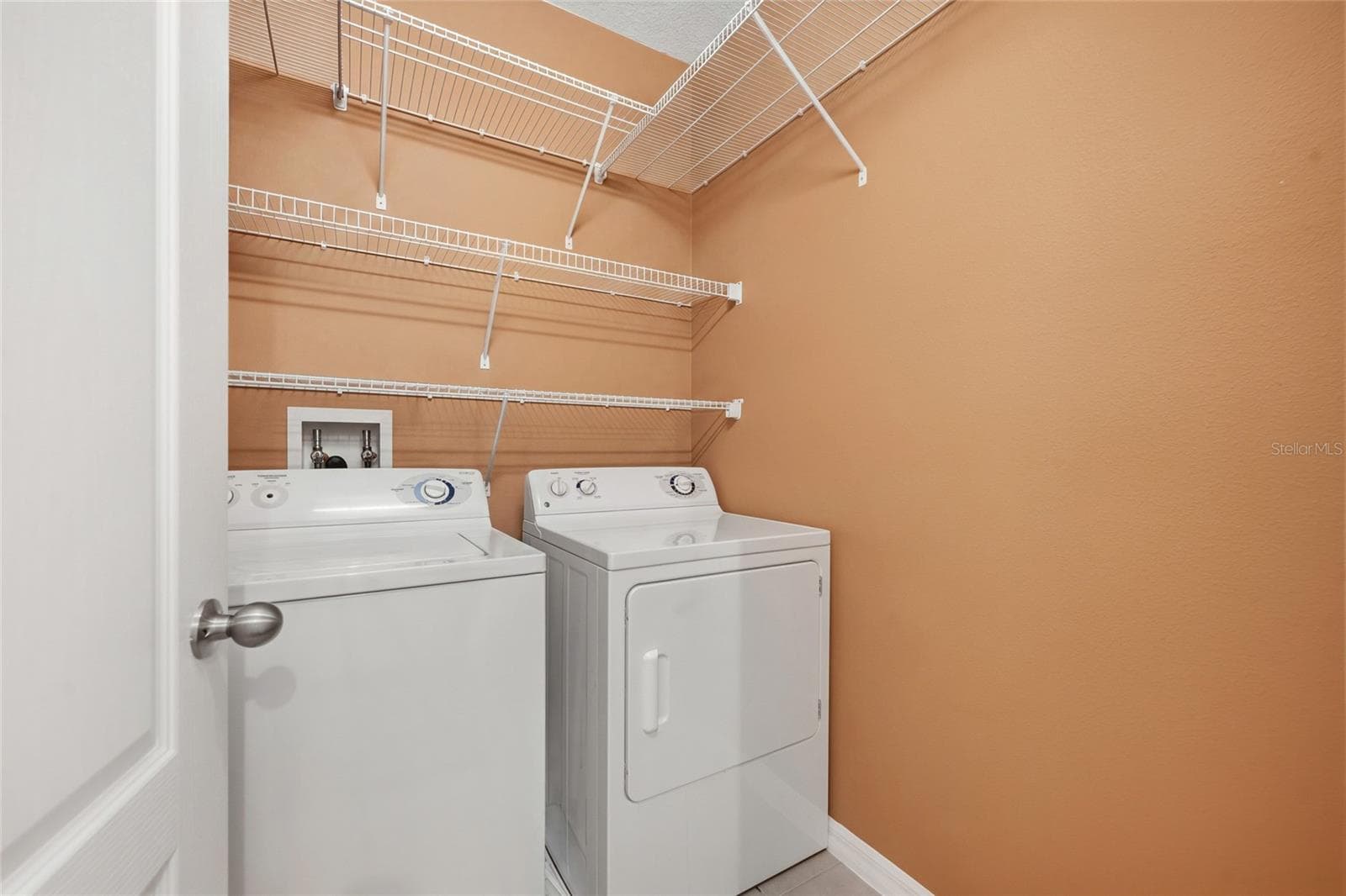 Laundry room featuring shelves - 15613 BOGGY OAK CIR #110A, WINTER GARDEN