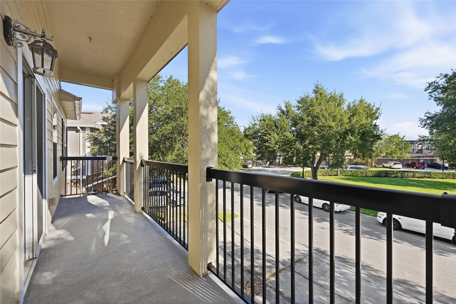 Beautiful balcony with views of cul-d-sac and grassy area - 15613 BOGGY OAK CIR #110A, WINTER GARDEN