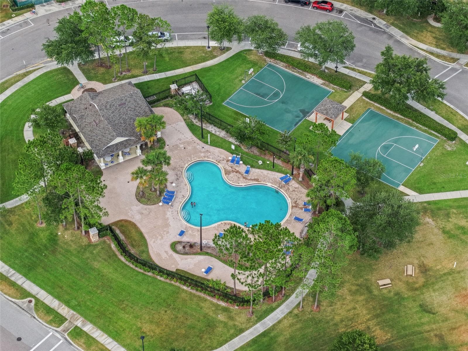 Community pool and recreation area with guest parking - 15613 BOGGY OAK CIR #110A, WINTER GARDEN