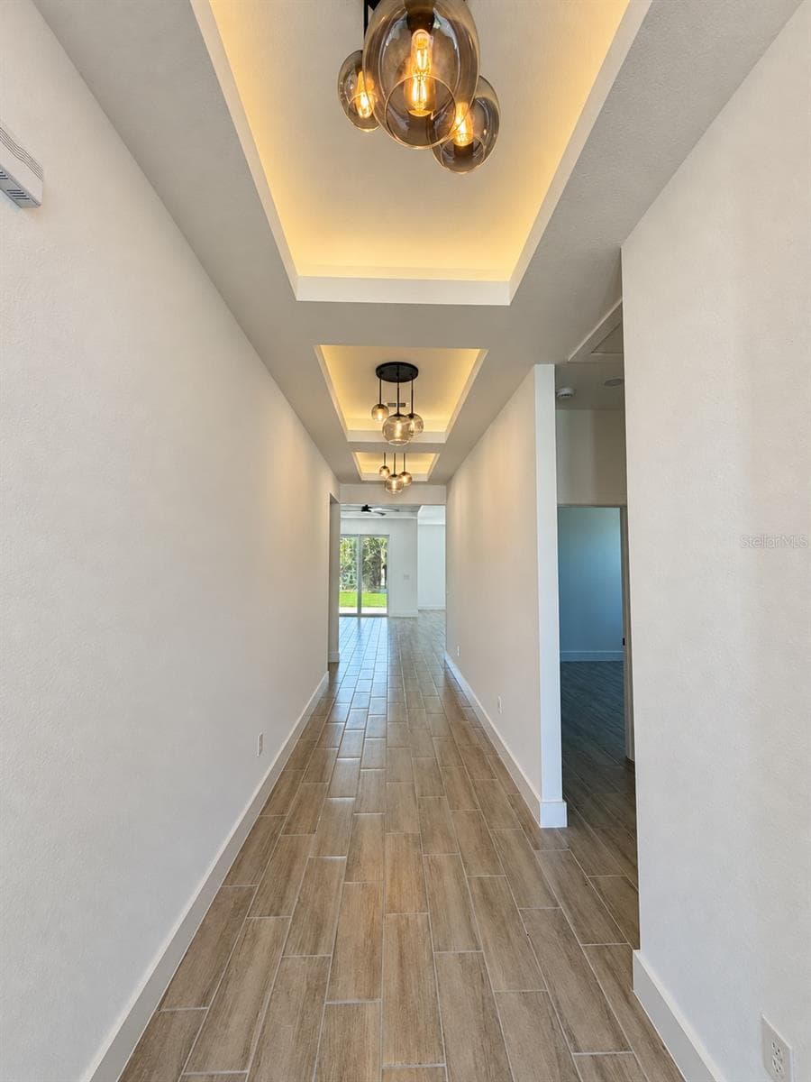 Entry lighting detail. Actual property photo, digitally refined. - 24479 SW KINGSWAY CIR, ARCADIA