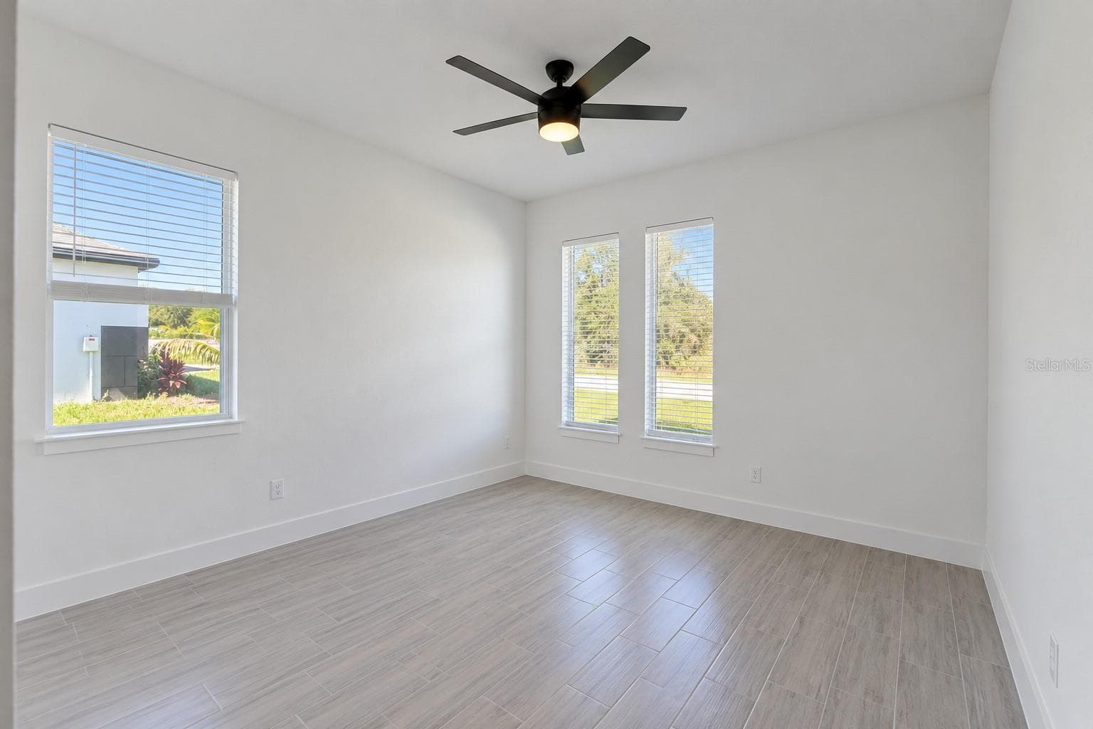 Front bedroom. Digitally edited model/property composite. - 24479 SW KINGSWAY CIR, ARCADIA