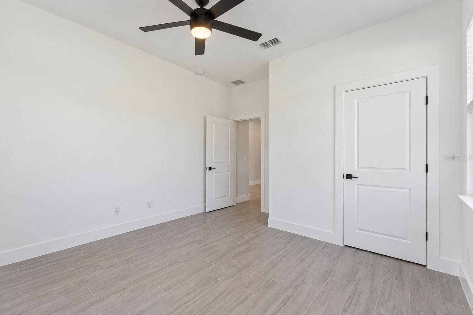 Front bedroom reverse view. Digitally edited model/property composite. - 24479 SW KINGSWAY CIR, ARCADIA