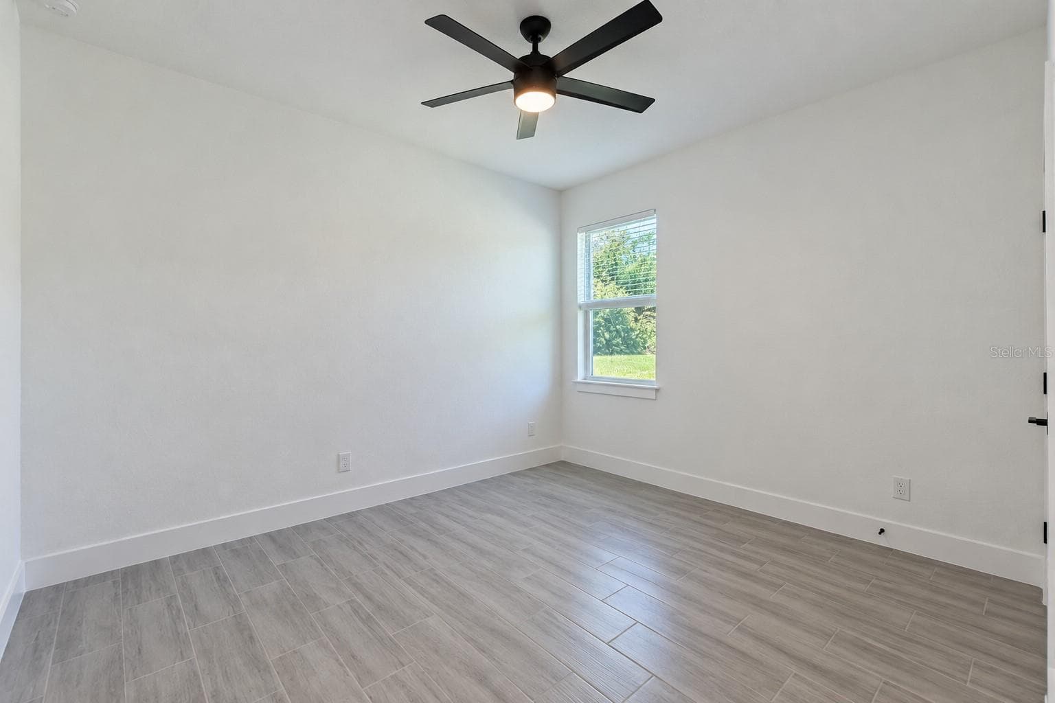 Bedroom two. Digitally edited model/property composite. - 24479 SW KINGSWAY CIR, ARCADIA