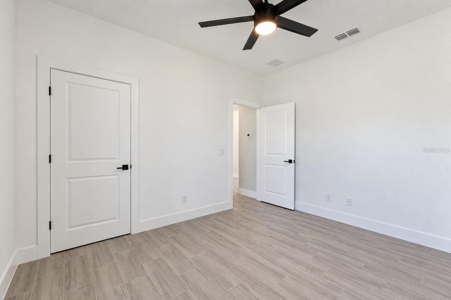 Bedroom two reverse view. Digitally edited model/property composite. - 24479 SW KINGSWAY CIR, ARCADIA