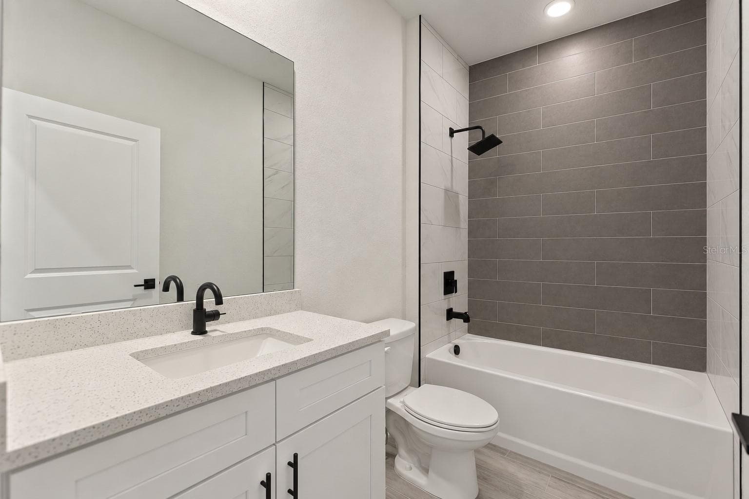 Guest bathroom. Digitally edited model/property composite. - 24479 SW KINGSWAY CIR, ARCADIA