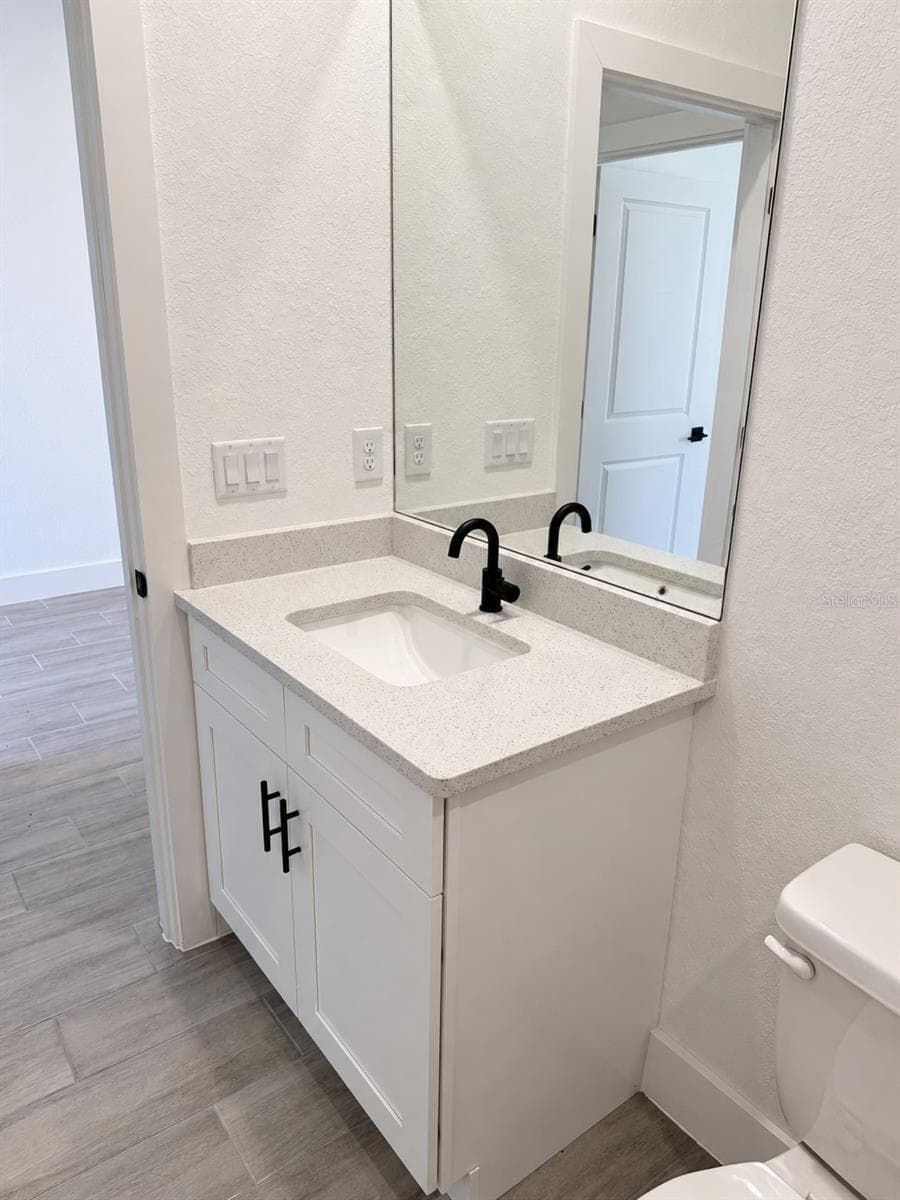 Guest vanity detail. Actual property photo, digitally refined. - 24479 SW KINGSWAY CIR, ARCADIA