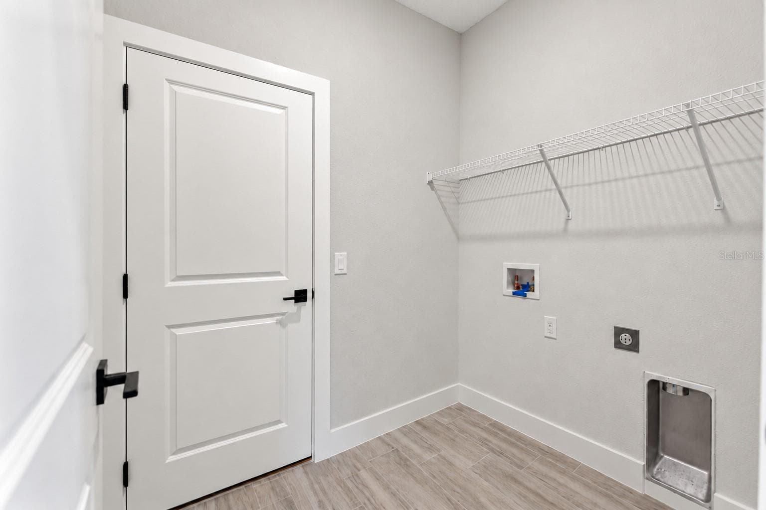 Laundry room. Digitally edited model/property composite. - 24479 SW KINGSWAY CIR, ARCADIA