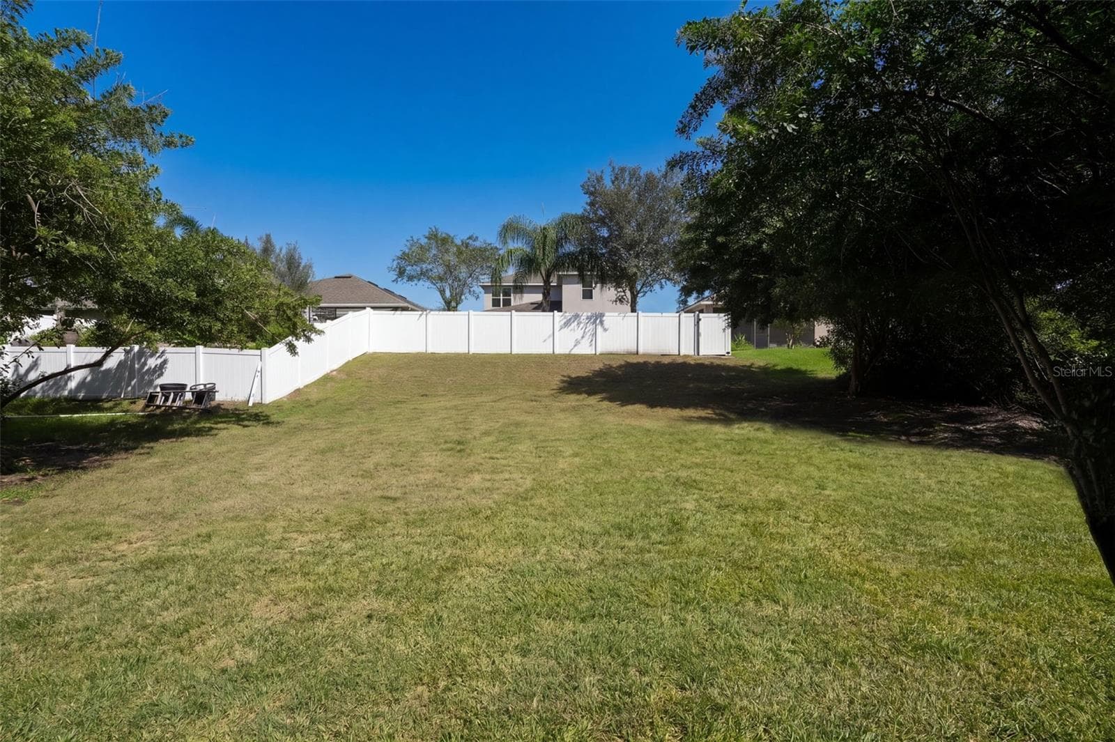 Additional yard space beyond the existing fence - 4773 RIVERWALK DR, ST CLOUD