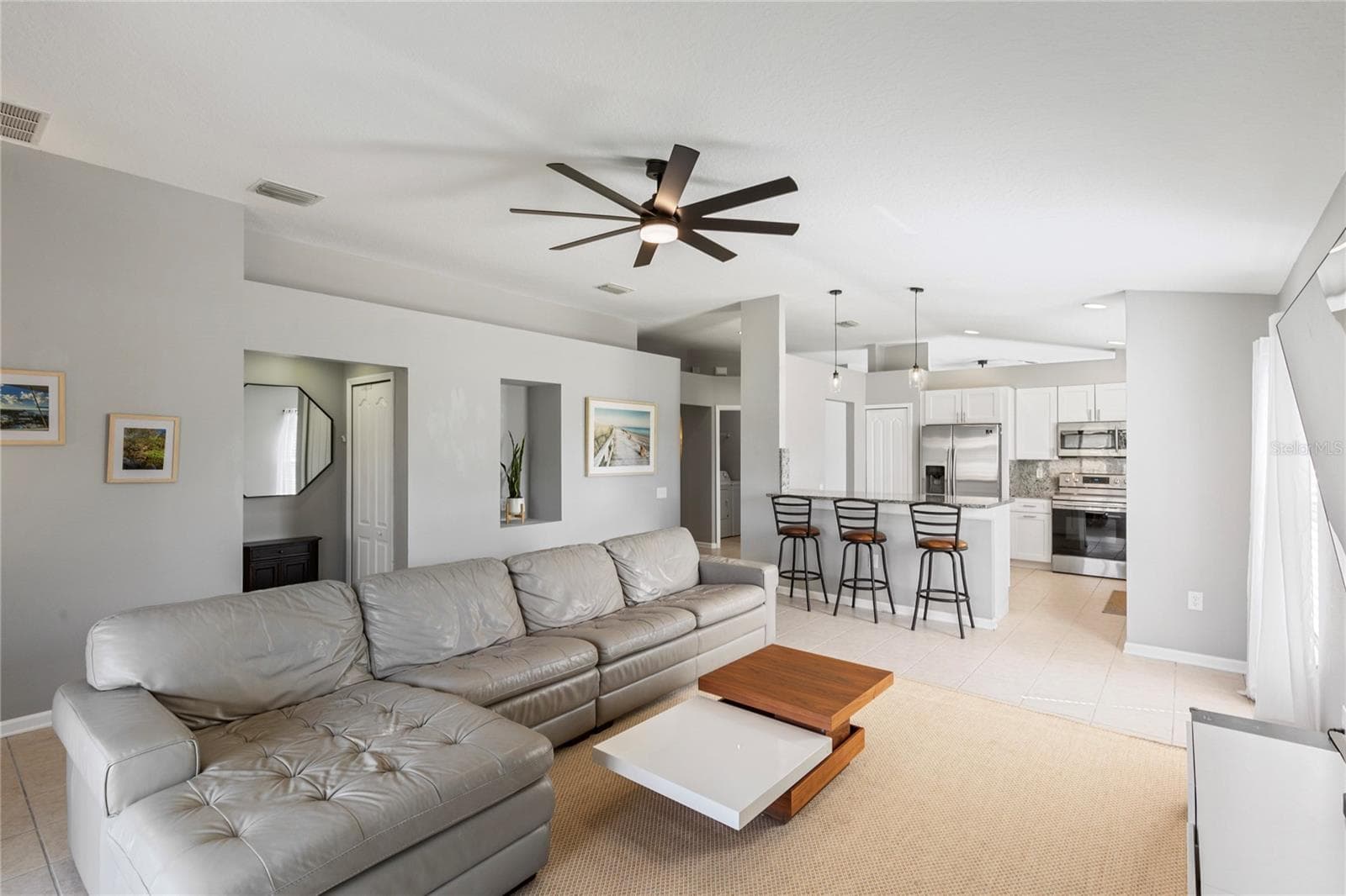 Open living, dining, and kitchen area - 7619 CRESCENT PALM DR, WESLEY CHAPEL