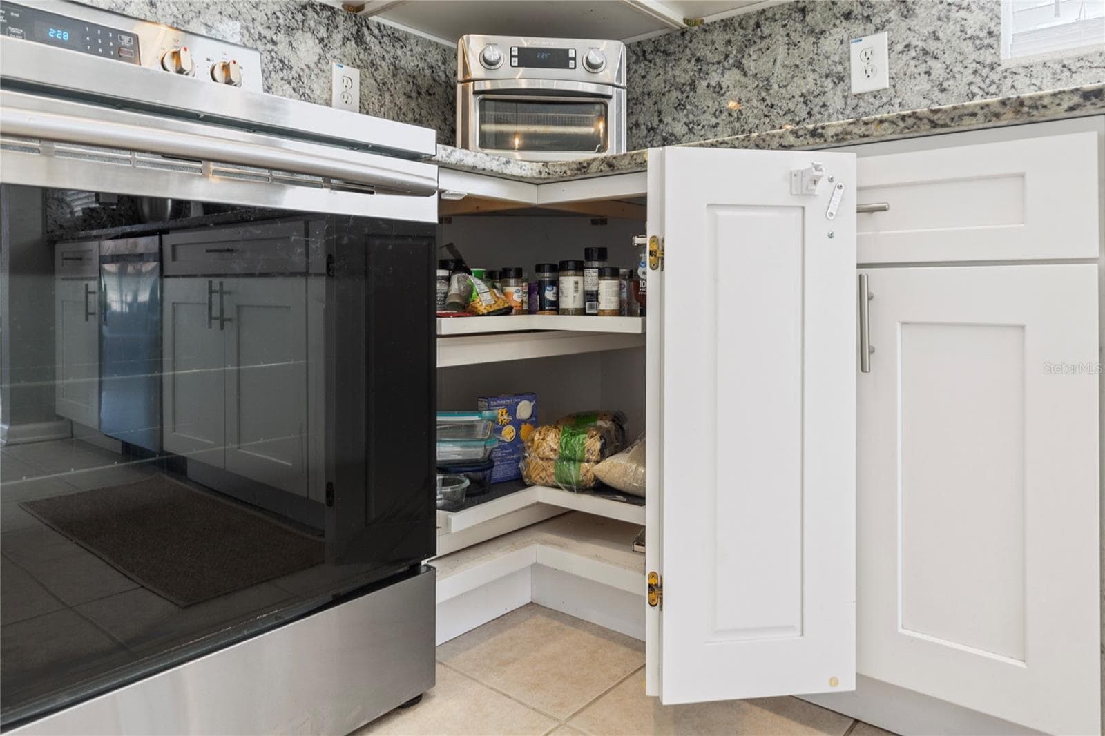 Built in corner storage in kitchen - 7619 CRESCENT PALM DR, WESLEY CHAPEL
