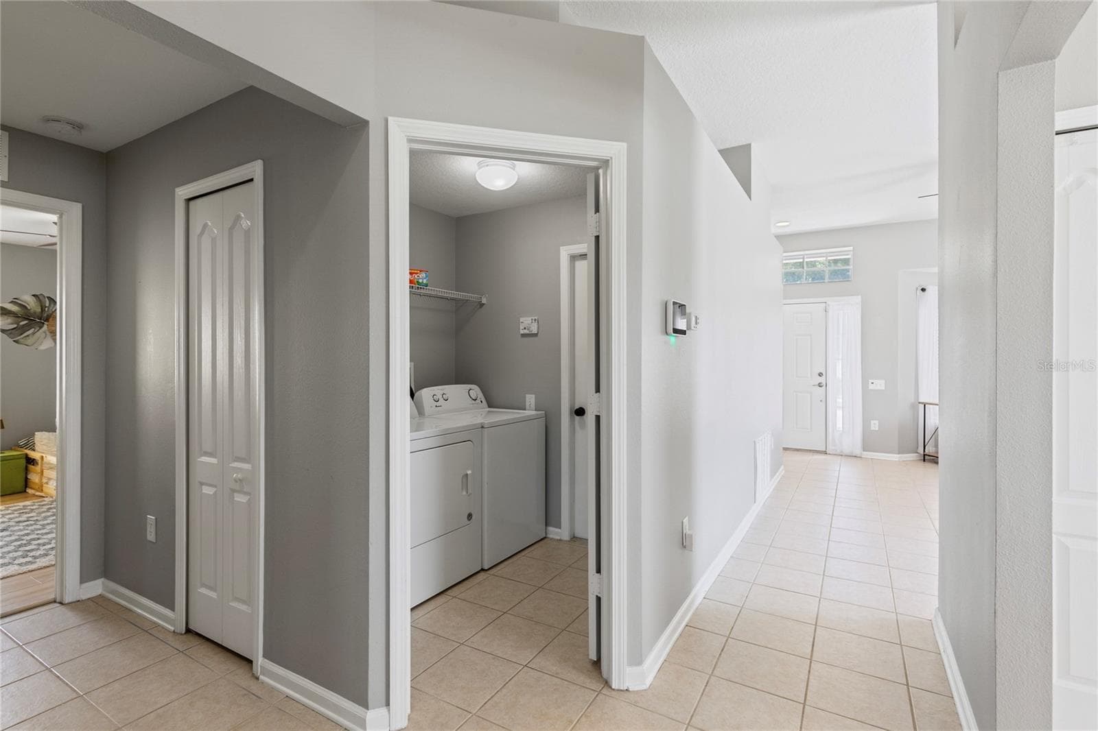Mud room and laundry - 7619 CRESCENT PALM DR, WESLEY CHAPEL
