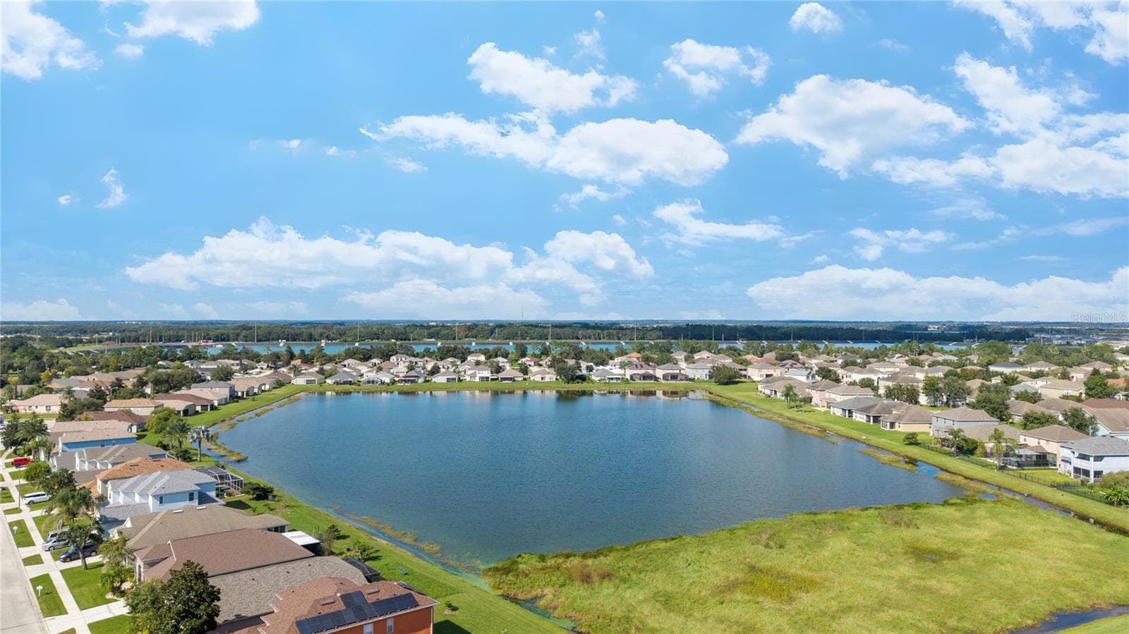 Large Ponds throughout community for viewing and drainage. - 7619 CRESCENT PALM DR, WESLEY CHAPEL