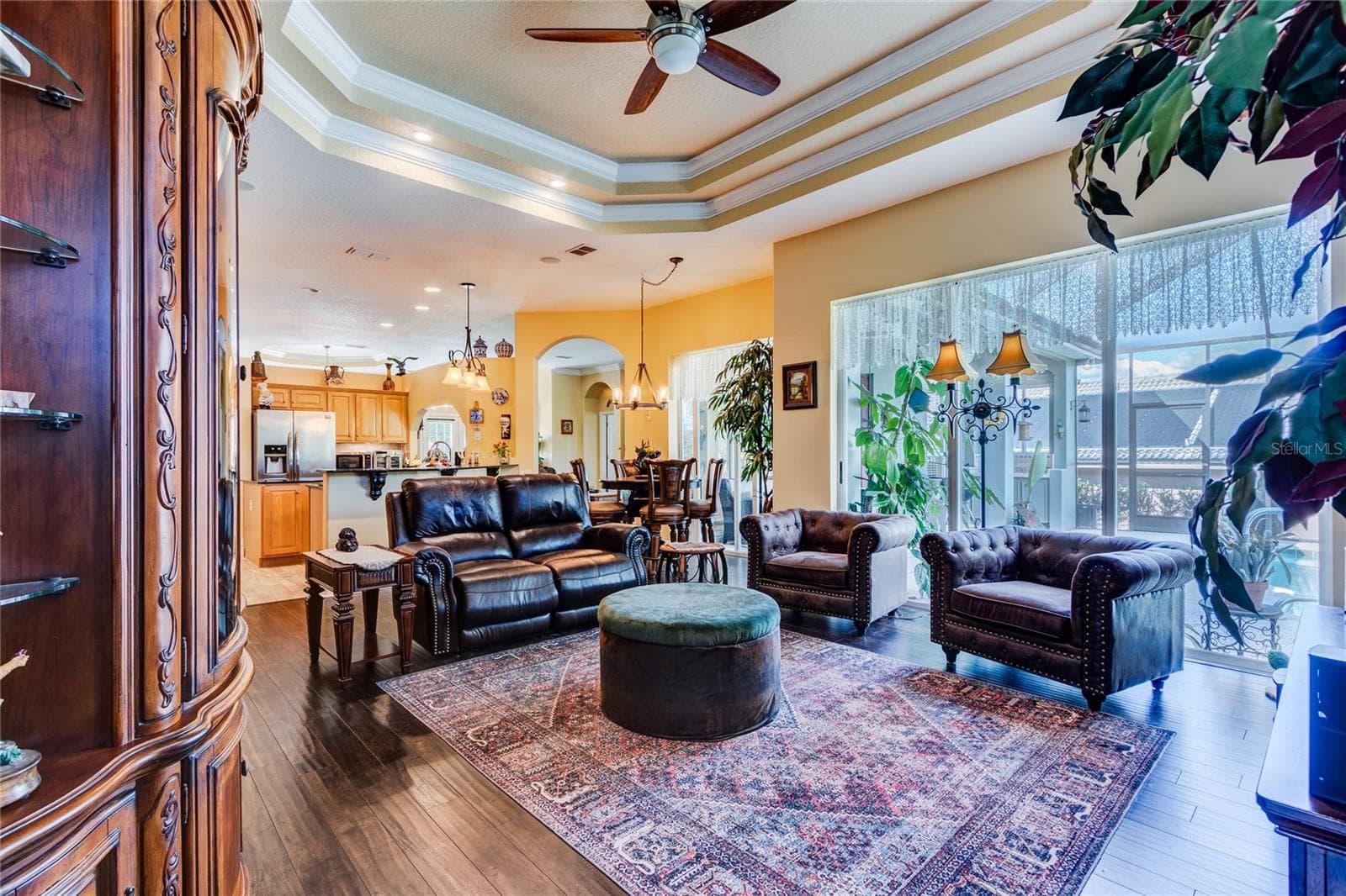 Great room is OPEN to the kitchen with sliding doors to the Lanai boasting Expansive Golf Course views - 13030 GRAND TRAVERSE DR, DADE CITY