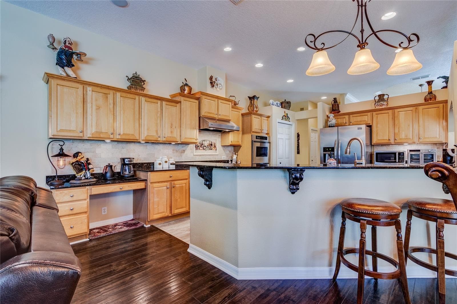 Kitchen with wood cabinets and higher end appliances - 13030 GRAND TRAVERSE DR, DADE CITY