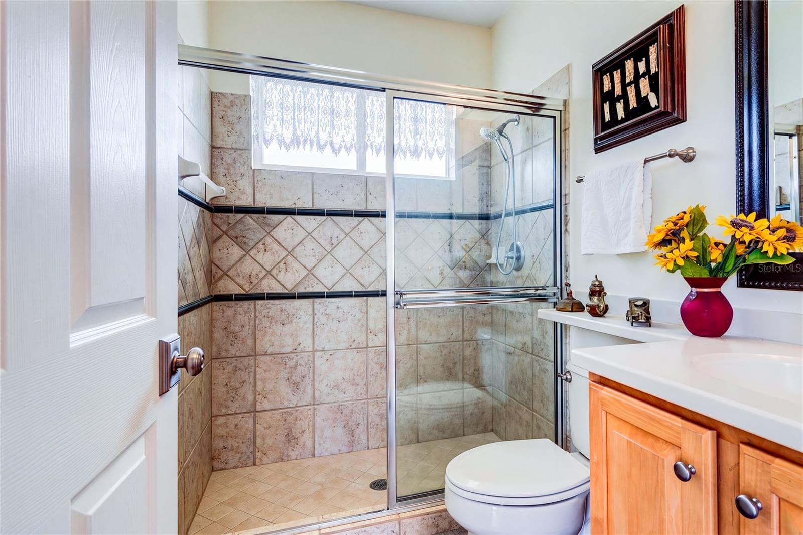 Back bath ensuite on same wing with door to access pool - 13030 GRAND TRAVERSE DR, DADE CITY