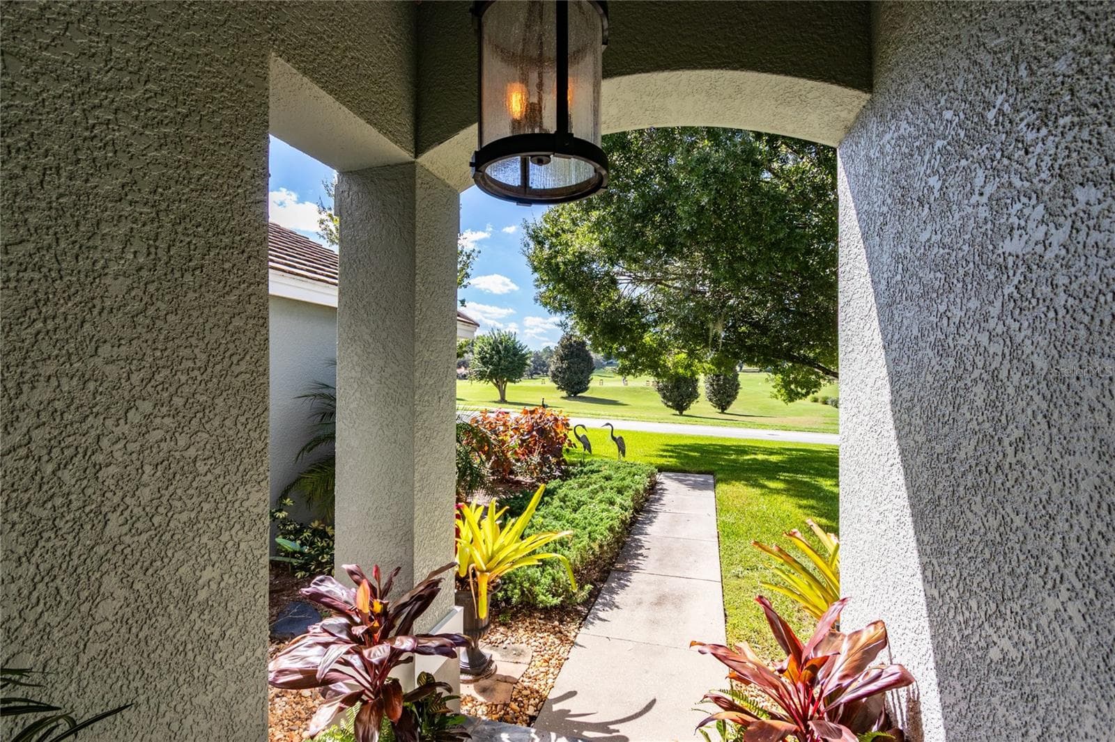 Front entry with view of front driving range - 13030 GRAND TRAVERSE DR, DADE CITY