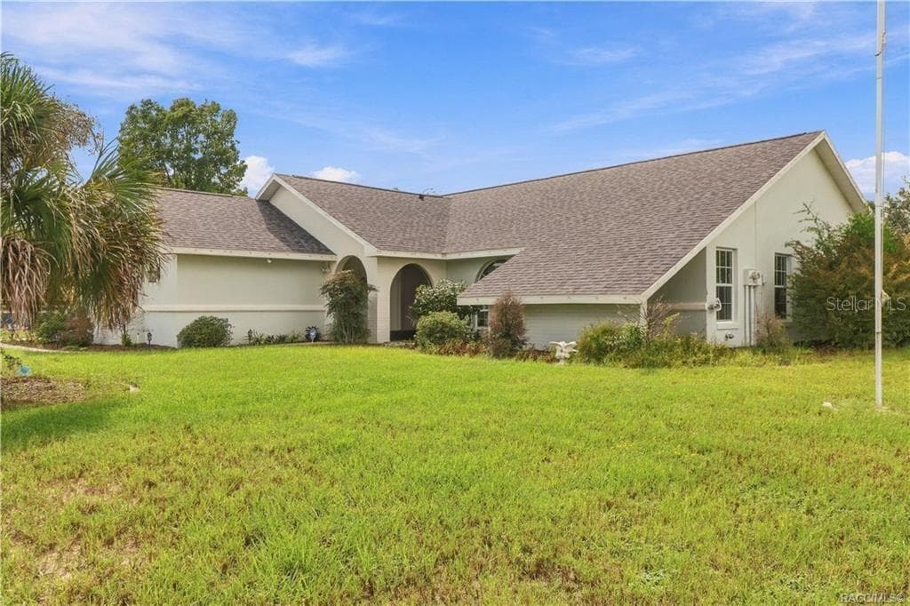 CONTEMPORARY RANCH EXTERIOR- A beautiful view of this concrete block/stucco contemporary ranch featuring distinctive rooflines & mature landscaping. - 1436 N CHERRY POP DR, HERNANDO