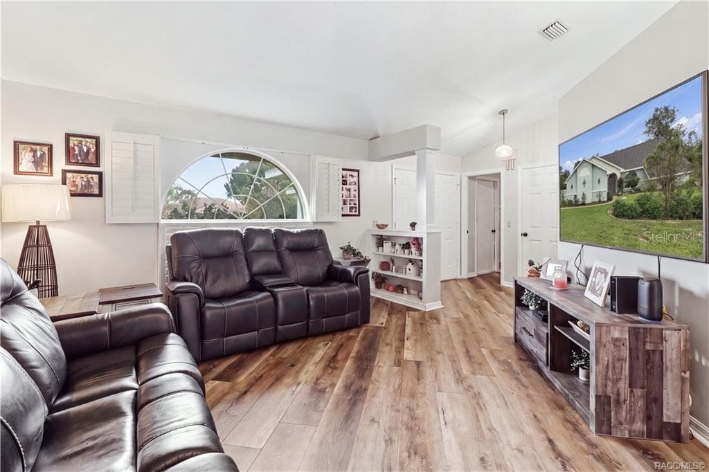 LIVING ROOM – ADDITIONAL VIEWAnother view of the spacious living room highlighting the open layout, natural light & luxury vinyl plank flooring. - 1436 N CHERRY POP DR, HERNANDO