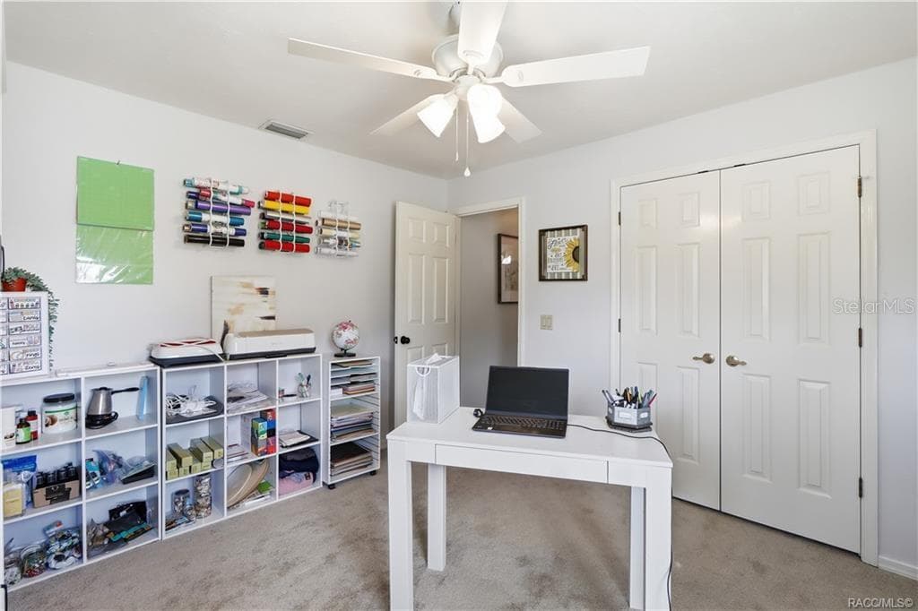 Versatile Bedroom or Home Office – Light-filled room featuring two windows, ceiling fan & comfortable space for a home office, guest bedroom or hobby room. - 1436 N CHERRY POP DR, HERNANDO