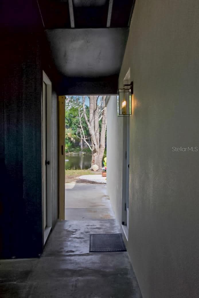 Walk Way from main living to Laundry Room and Car Port - 405 MANOR BLVD, PALM HARBOR