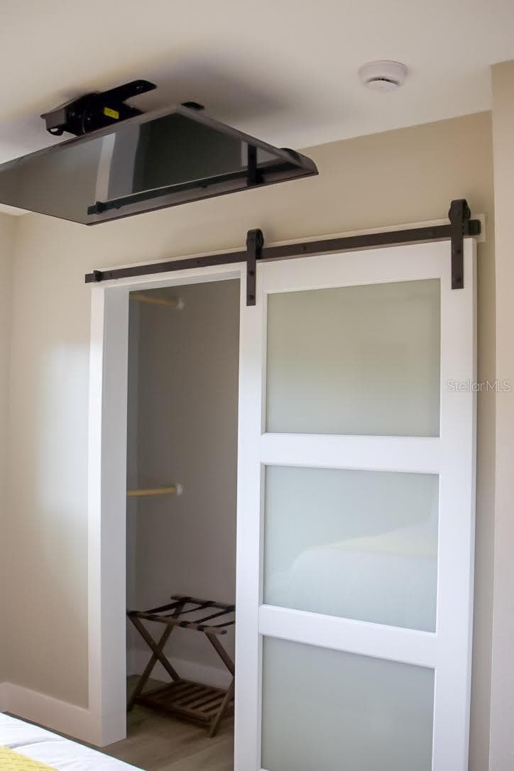 Primary Walk in Closet w/Remote controlled TV mounting system - 405 MANOR BLVD, PALM HARBOR