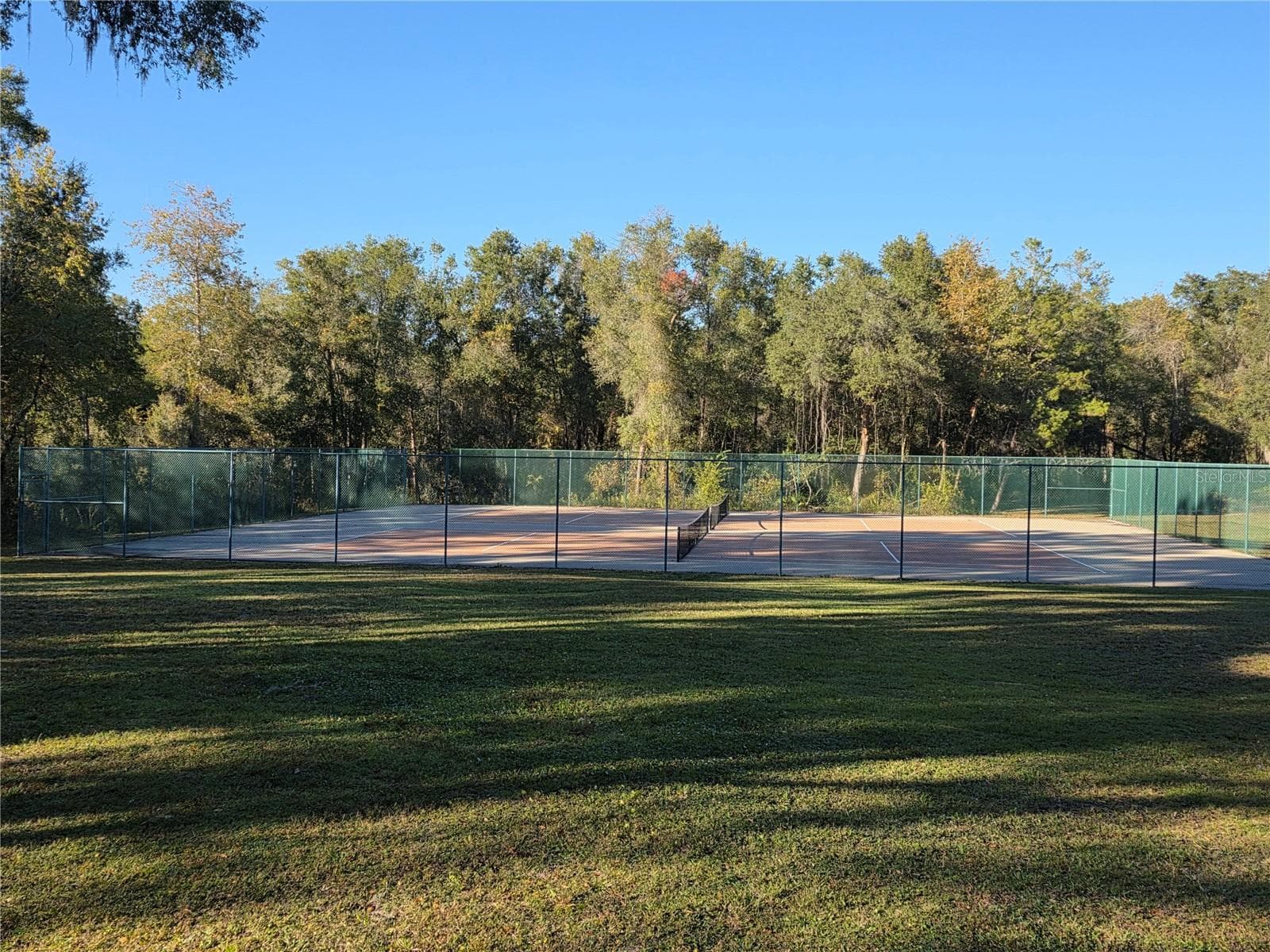 Within Glen Aire there is a park only for the residents of this private community. This is the tennis court - 3418 SW 155TH PL, OCALA